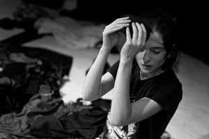 Actress portrait taking off her mask