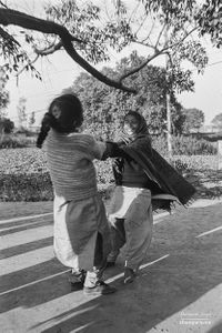 Girls playing a spinning game  | Dhanda, Punjab.