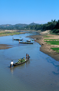 boats carrying bananas and women working in the fields, Near Ramu, near Cox's Bazaar, Bangladesh