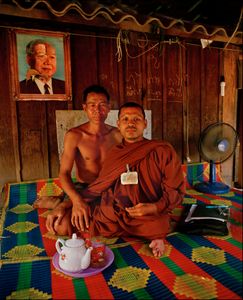 Buddhist priest with AIDs victim, Cambodia  2001