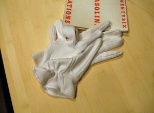 Two gloves and Ed Ruscha's artist's book 'TWENTYSIX GASOLINE STATIONS," 1963, photo 2006-LK.