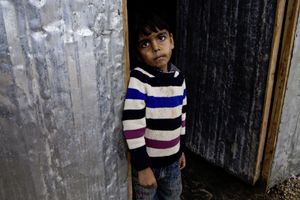Child waiting to go to the toilet facilities. © Tom Verbruggen
