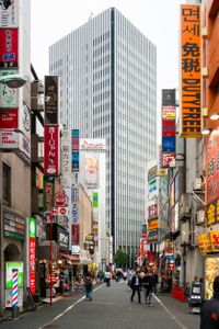 A serene tower at the end of the chaotic street.