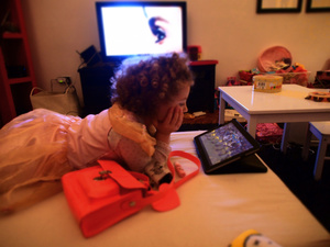 Margot watching cartoon before going to sleep