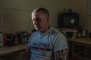 A prisoner sitting in his cell on the enhanced wing. HMP/YOI Portland, Dorset
