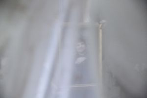 Ekaterina is holding the photograph of Alexei