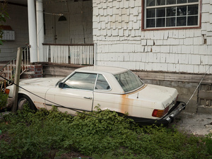 USA. New York. 2015. Car parked out of a house.