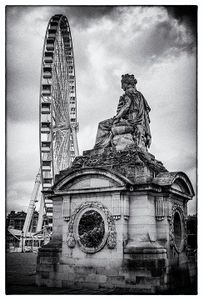 Statue and Ferris Wheel.