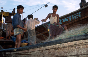 Fishermen checking net, St martin island, Bangladesh