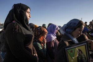 Kurdish refugee women attend a funeral of YPG and YPJ fighters in Suruc, Turkey on November 7, 2014.