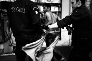 The police force arresting a refugee after he stole a woman's mobile in the center of Athens, Greece Enri Canaj
