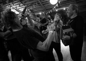 The acoustic instruments are placed in the middle of the dance floor so that the dancers are hear the music over the rather loud dance.