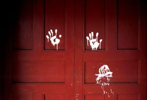 Mano Blanca, signature of the death squads, left on the door of a slain peasant organizer. Arcatao, El Salvador, 1980 © Susan Meiselas / Magnum Photos. Courtesy Thames and Hudson.