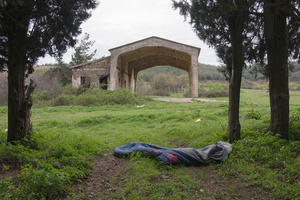 An abandoned sleeping bag near a forest by the Macedonian border outside of Evzoni, Greece. March 24, 2016.