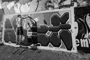 Man painting graffiti in the East End