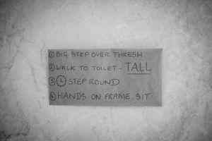 Instructions written on the wall of the toilet give a reminder. My father's short term memory fades in and out at various times of the day.