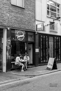 Couple eating out in Soho