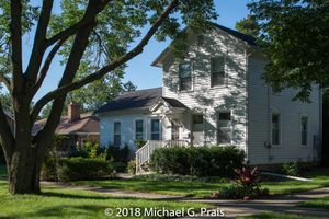 White Farmhouse with Tree
