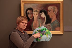 Artist and Professor Marilena Preda-Sânc in front of the painting by Margareta Sterian, © National Museum of Art, Bucharest