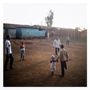 A family play with a ball in Kibera. The Kibera slum is the largest slum in Nairobi with around half a million inhabitants.