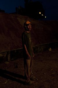 Kep province, Cambodia. Jan 2013. Worker in a road construction site near the Vietnam’s border. Few “Highways” in the country, all in very poor conditions. Most of the secondary roads are still unpaved.