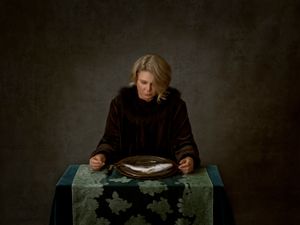 Woman with Fish on a Plate