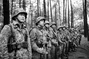 Indonesian men dressed up as German Waffen-SS soldiers stand in formation during a gathering of re-enactment enthusiasts in Cibubur, East Jakarta, Indonesia.