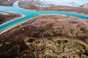 Typical lagoon structures consist of mudlats, salt marshes and meandering canals used to navigate through to the islands in the lagoon.