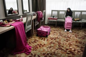 Yogyakarta. Girl takes a rest after the fitting for the Grand Final of World Muslimah Award.