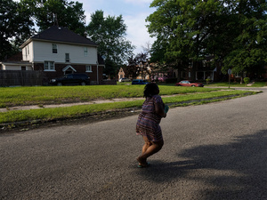 USA. Detroit. 2015. Girl running.