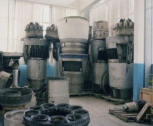 #01981 - Much of the hardware that remains at LAB consists of old engines and unused parts. Because the airline can no longer afford to buy replacements, engine casings continue to pile up, empty and unused.