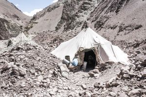 A CANVAS TENT, HOME TO A ROAD WORKER'S FAMILY