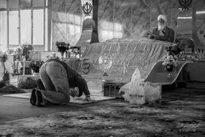 Man bows before Guru Granth in Gurdwara, Nottingham