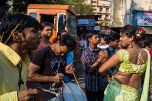 during Mumbai's gay pride march - the woman in yellow is a hijra.  On her back, in red paint, someone has written, "STOP 377".  Section 377 of the Indian Penal Code is a Victorian, colonial era provision that declares consensual homosexual acts in private a criminal offence punishable with life imprisonment.  © Alison McCauley