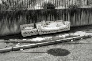 Abandoned couch and a snow blanket