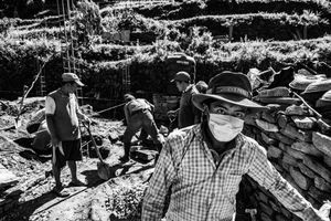 Men rebuilding houses destroyed by the earthquake of April 2015. Mandre, Gorkha District, near the epicenter