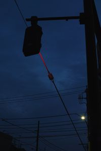 Steel wire illuminated by traffic lights.