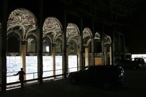 The Michigan Theatre, built in 1926, was transformed into a parking garage in the 1970's. Before parked cars filled the space Bob Hope, Jimmy Dorsey and the Marx Brothers, among others, packed the large theatre. There was seating for about 4,000 and the opulent French Renaissance design was unrivaled in Detroit.  © Nicholas Gregory