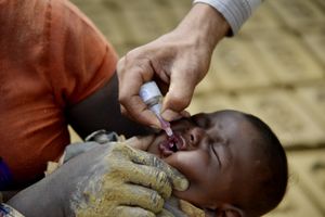 A child gets vaccinated at a brick kiln in Aligarh, Uttar Pradesh