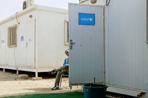 A UNHCR member taking a cigarette break. © Tom Verbruggen