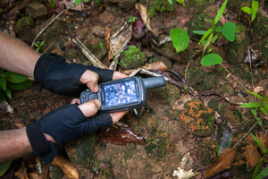 Using a GPS unit, the ADF team compares the findings with the LIDAR data during a ground check expedition. Siem Reap Province, Cambodia.