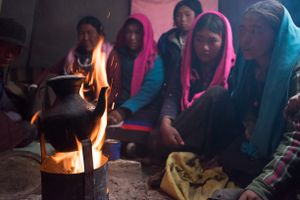 People from Karang rest in a tent after a day's work. Upper Dolpo, Nepal, June 2017.