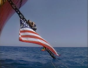At sea, off the port of Genoa, Italy (2001). Climate. Power. A young protester, chained to the anchor of an oil tanker, on the eve of the start of a G8 Summit.