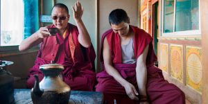 Tibetans took Chinese tea from the south and turned it into a very different, full-bodied nutritional drink, adding yak butter and salt. Monks at Songzanlin monastery in Shangri-La enjoy a morning cup. © Michael Freeman