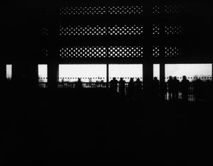 People looking across the Thames