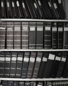 Shelves of photo albums from the 1940s through today. She used to say that if there were a fire in her home, she would grab her photo albums first. But now she worries there are too many. I told her to grab the oldest ones.