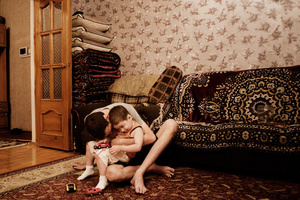 A russian guy plays with his nephew.