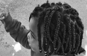 Little girl at a bus stop