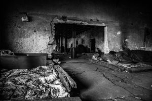 Inside a derelict warehouse, which is shelter for refugees. Belgrad, Sebia.