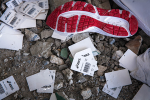 Wing Star shoe factory sources Japanese brand Asics. Shoe soles and tags are seeing on the rubble after a building collapsed killing two.